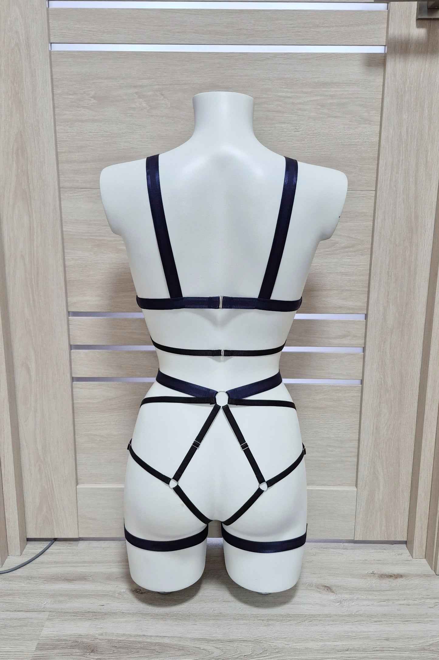 Hemera - navy blue female harness lingerie set with leg garters